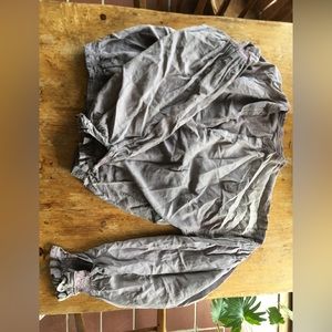 Heavily worn, purple pheasant blouse.